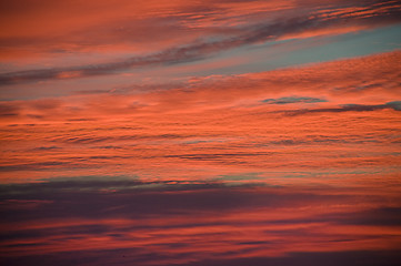 Image showing Pink and orange clouds at sunrise