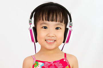 Image showing Chinese little girl on headphones