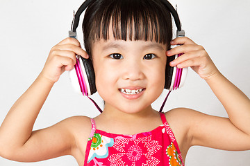 Image showing Chinese little girl on headphones