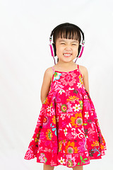 Image showing Chinese little girl on headphones