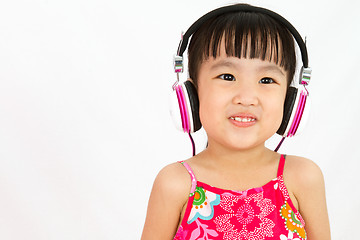 Image showing Chinese little girl on headphones