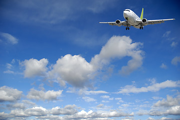 Image showing Air travel - Plane flying in blue sky with clouds