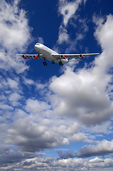 Image showing Air travel - Plane is flying in blue sky with clouds