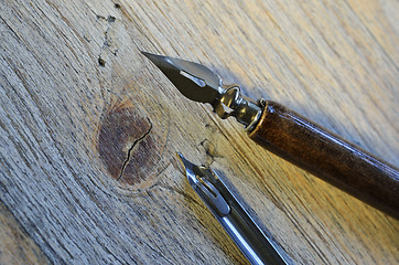 Image showing fountain pen on wooden background 