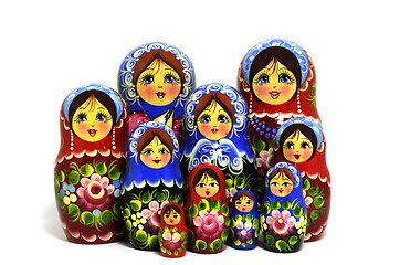 Image showing lot of traditional Russian matryoshka dolls on white