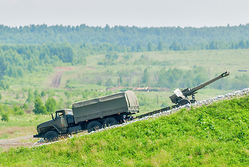Image showing army truck transports a gun