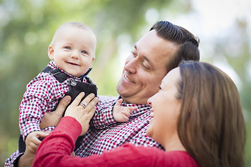 Image showing Little Baby Boy Having Fun With Mother and Father Outdoors