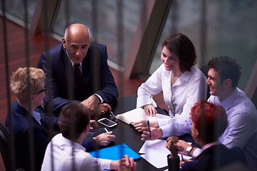 Image showing business people group on meeting at modern bright office