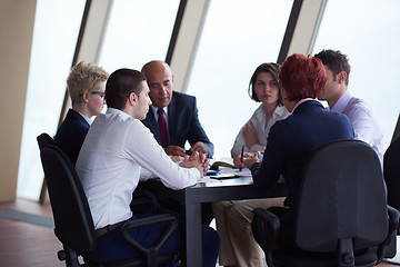 Image showing business people group on meeting at modern bright office