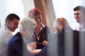 Image showing business people group on meeting at modern bright office