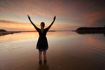 Image showing Woman outstretched arms praising perfect day success