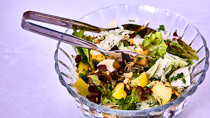 Image showing Salad with pears, nuts and greens