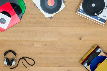 Image showing Records With Turntable On Wooden Table