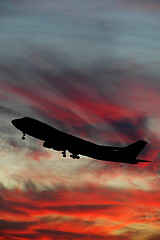 Image showing Silhouette of plane and sunset