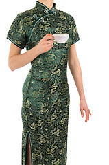 Image showing Woman in Chinese dress with a cup of tea