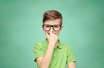 Image showing happy school boy in green t-shirt and eyeglasses