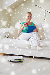 Image showing happy woman with tablet pc drinking tea at home