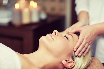 Image showing close up of woman having face massage in spa