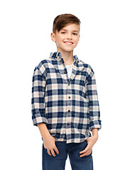 Image showing smiling boy in checkered shirt and jeans