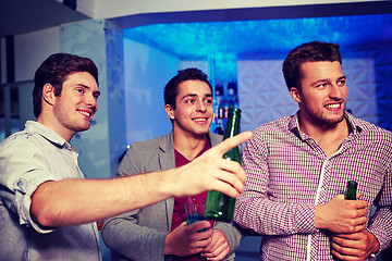 Image showing group of male friends with beer in nightclub