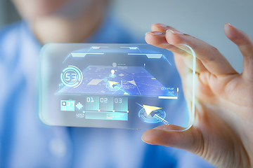 Image showing close up of woman with transparent smartphone