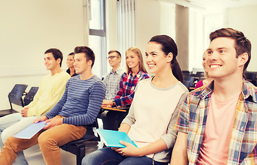 Image showing group of smiling students in lecture hall