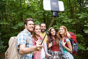 Image showing friends with backpack taking selfie by smartphone