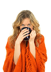 Image showing Cozy girl enjoying a cup of tea