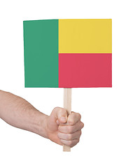 Image showing Hand holding small card - Flag of Benin