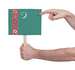 Image showing Hand holding small card - Flag of Turkmenistan