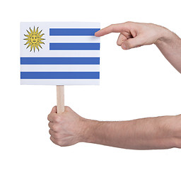 Image showing Hand holding small card - Flag of Uruguay