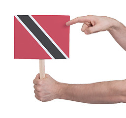 Image showing Hand holding small card - Flag of Trinidad and Tobago