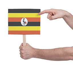 Image showing Hand holding small card - Flag of Uganda