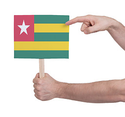 Image showing Hand holding small card - Flag of Togo