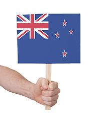 Image showing Hand holding small card - Flag of New Zealand