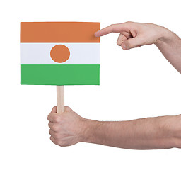 Image showing Hand holding small card - Flag of Niger