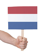 Image showing Hand holding small card - Flag of the Netherlands