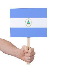 Image showing Hand holding small card - Flag of Nicaragua