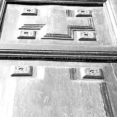 Image showing texture of a brown old door in italy europe