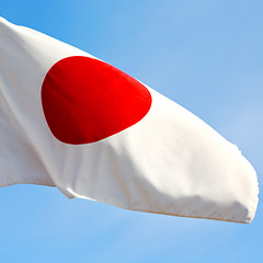 Image showing japanb waving flag in the blue sky bcolour and wave