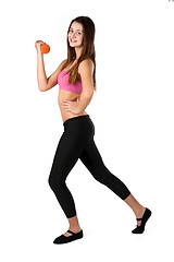 Image showing Young smiling fitness woman working out