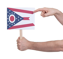 Image showing Hand holding small card - Flag of Ohio