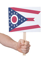 Image showing Hand holding small card - Flag of Ohio