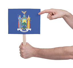 Image showing Hand holding small card - Flag of New York