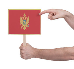 Image showing Hand holding small card - Flag of Montenegro