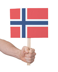 Image showing Hand holding small card - Flag of Norway