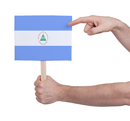 Image showing Hand holding small card - Flag of Nicaragua