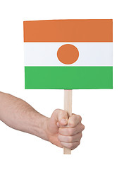 Image showing Hand holding small card - Flag of Niger