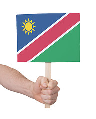 Image showing Hand holding small card - Flag of Namibia