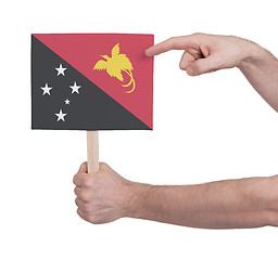 Image showing Hand holding small card - Flag of Papua New Guinea